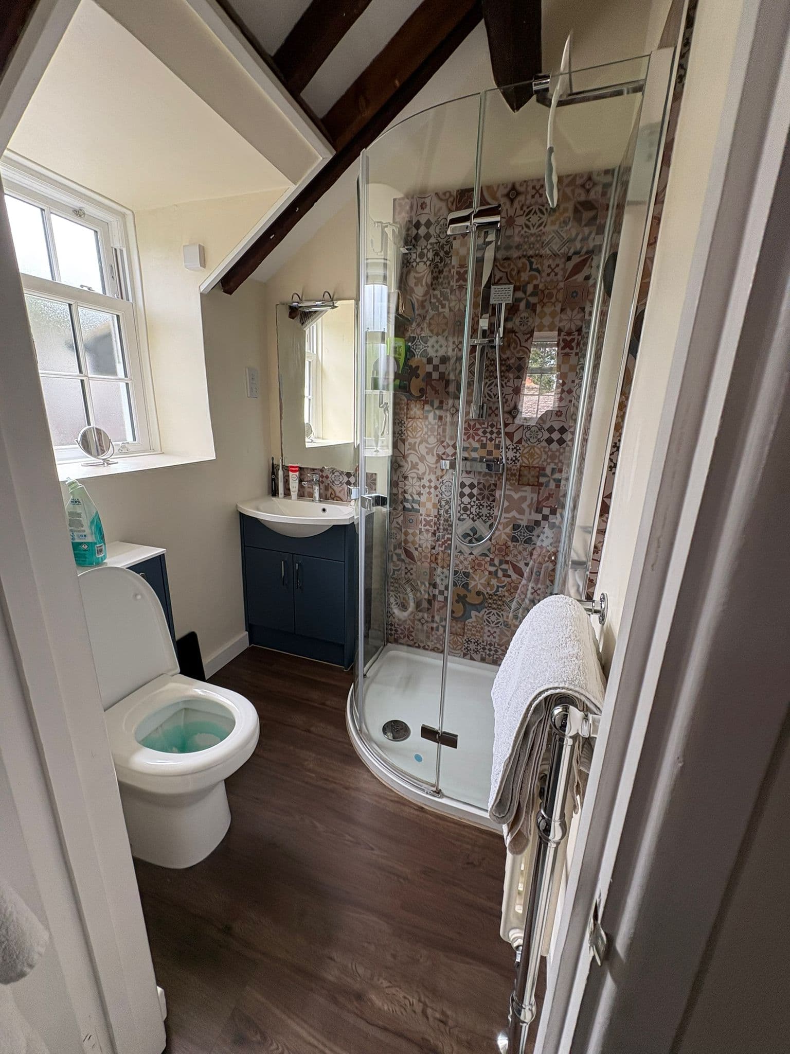 A characterful patterned-tile shower room in Bicester, freshly cleaned
